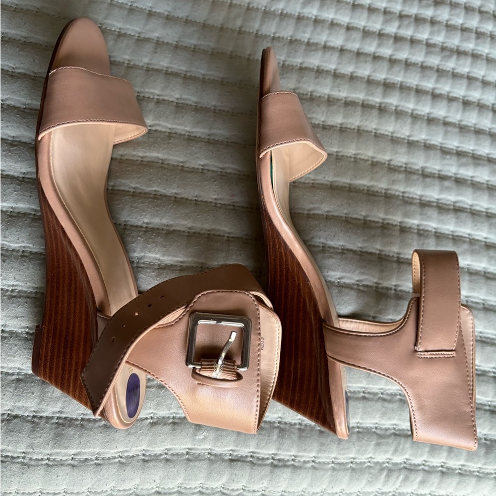 New, Nine West cream color wedges. There is 1 small indent on right shoe.